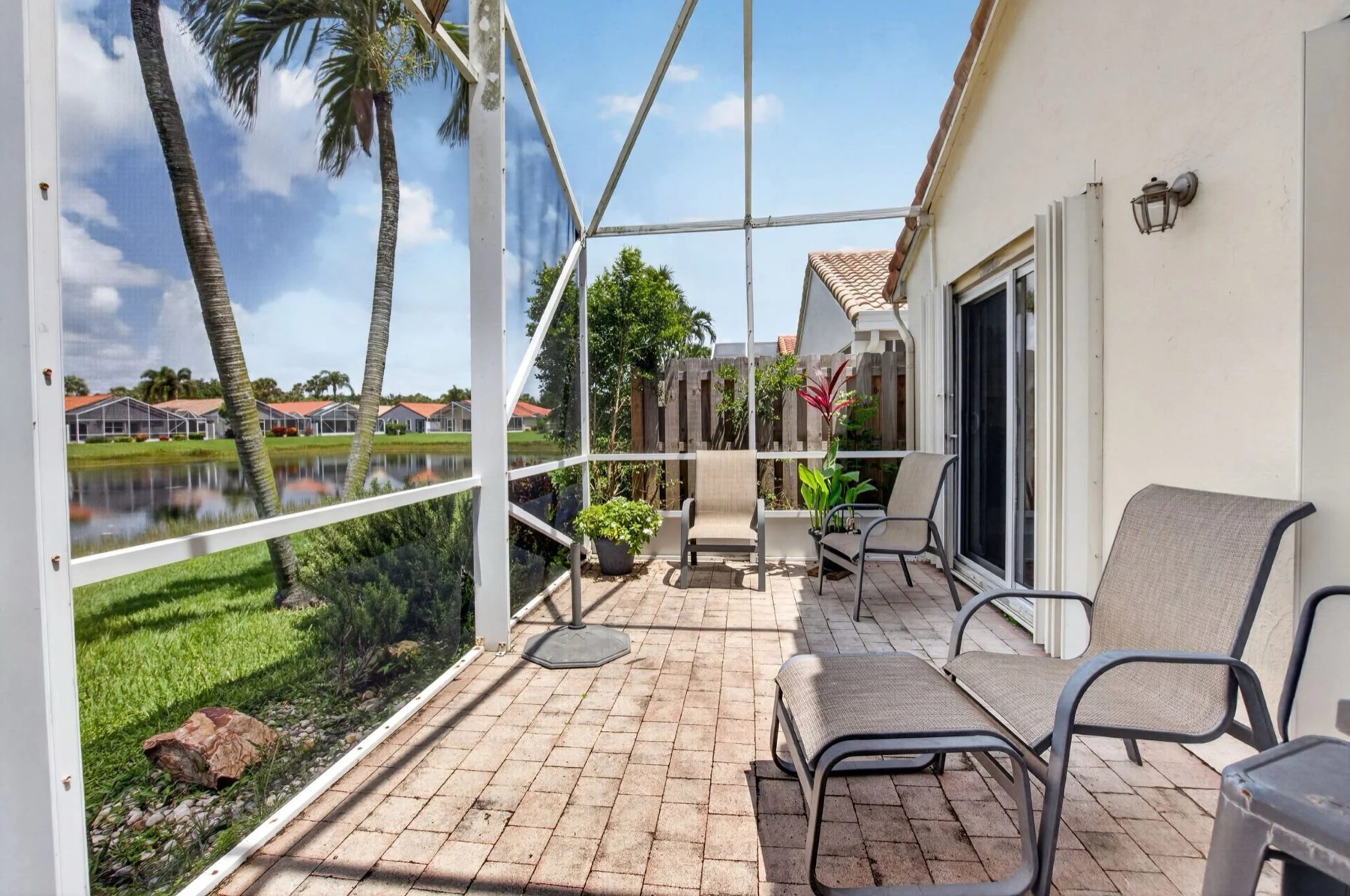 Extended Screened Lanai With a Retractable Awning