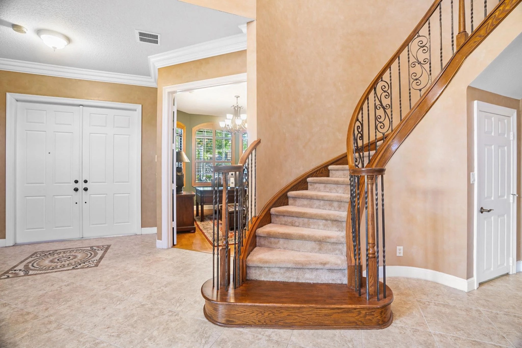 Two Story Foyer & Wrought Iron Staircase